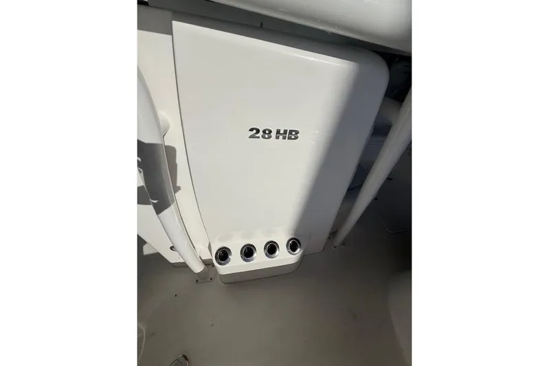  Yacht Photos Pics 2025 Caymas 28 HB boat detail with model name and rod holders.