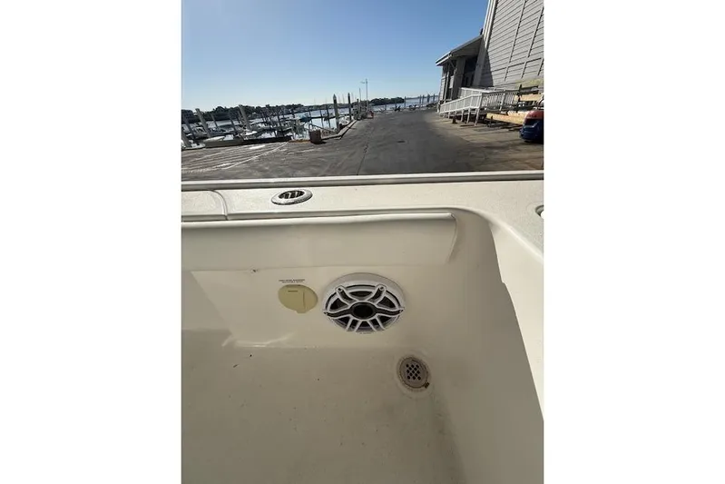  Yacht Photos Pics 2025 Caymas 28 HB boat interior with speaker and marina view.