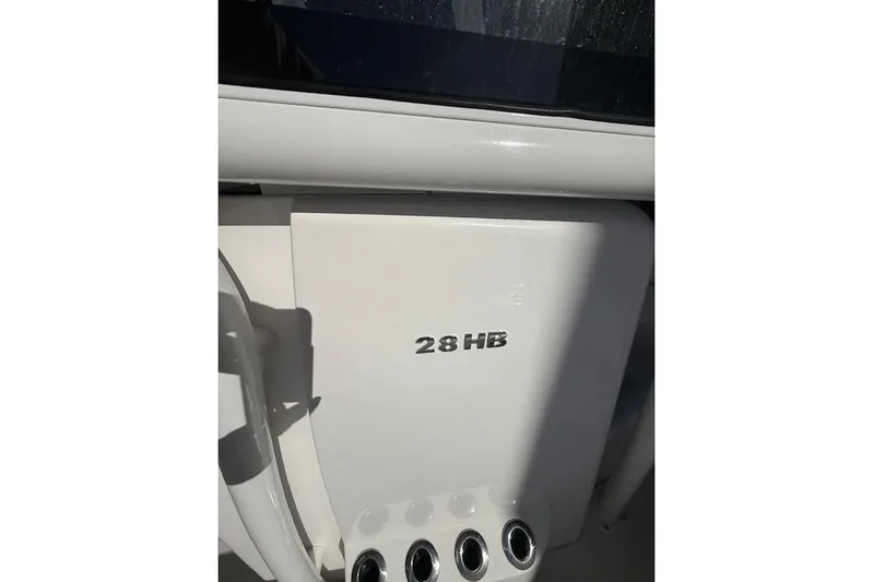  Yacht Photos Pics 2025 Caymas 28 HB boat dashboard with model insignia.