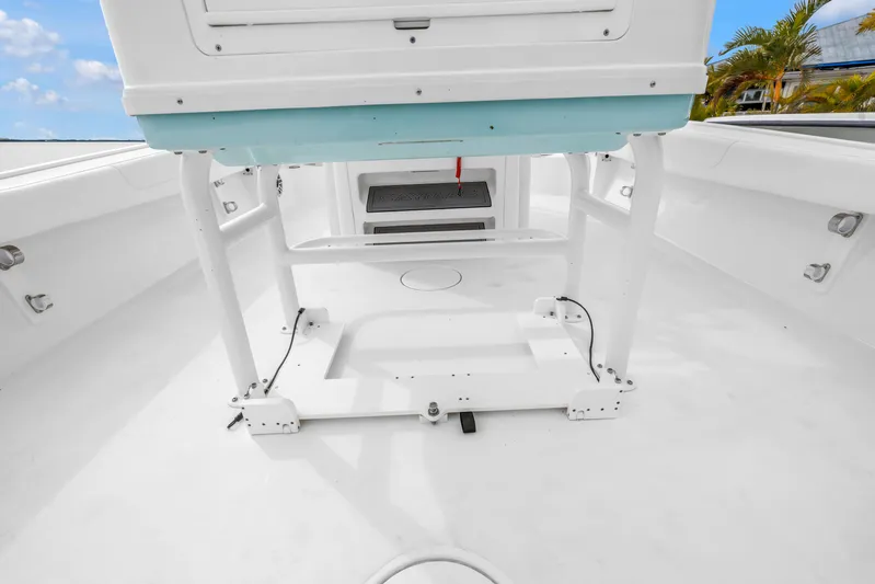  Yacht Photos Pics 2025 Caymas 28 HB boat interior, showcasing spacious white deck and seating area.