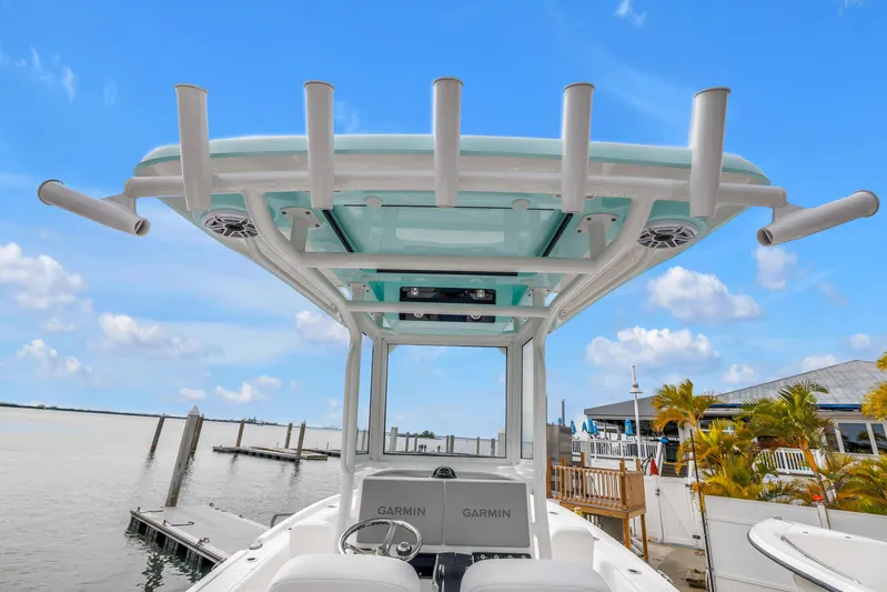  Yacht Photos Pics 2025 Caymas 28 HB boat with T-top and Garmin electronics, docked by a marina.