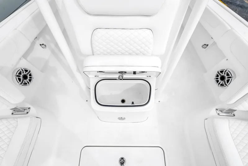  Yacht Photos Pics 2025 Caymas 28 HB boat interior with white seating and built-in speakers.