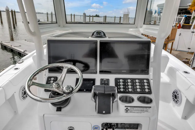  Yacht Photos Pics Helm of 2025 Caymas 28 HB boat with dual screens and steering wheel.