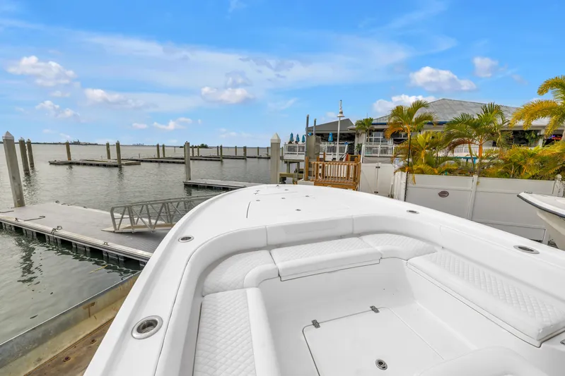  Yacht Photos Pics 2025 Caymas 28 HB boat docked at marina with clear blue sky.