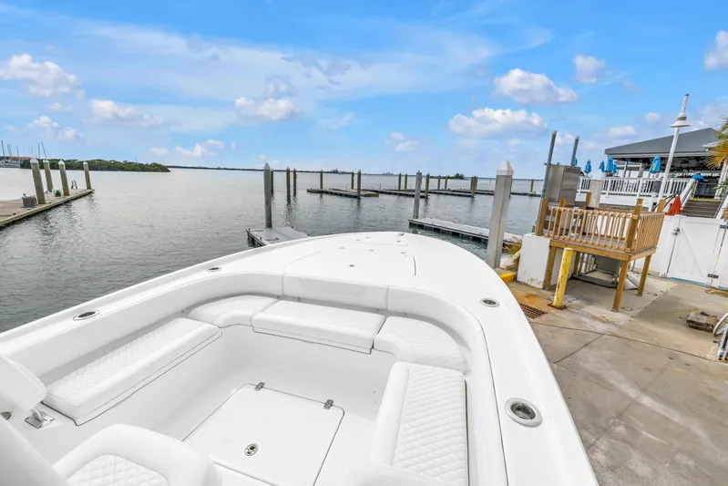  Yacht Photos Pics 2025 Caymas 28 HB boat docked at marina with clear blue sky.