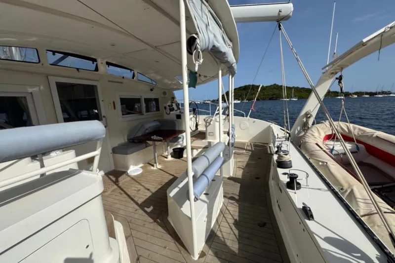 Alita Too Yacht Photos Pics Spacious deck of 2018 Custom COAST 50 yacht with seating and ocean view.