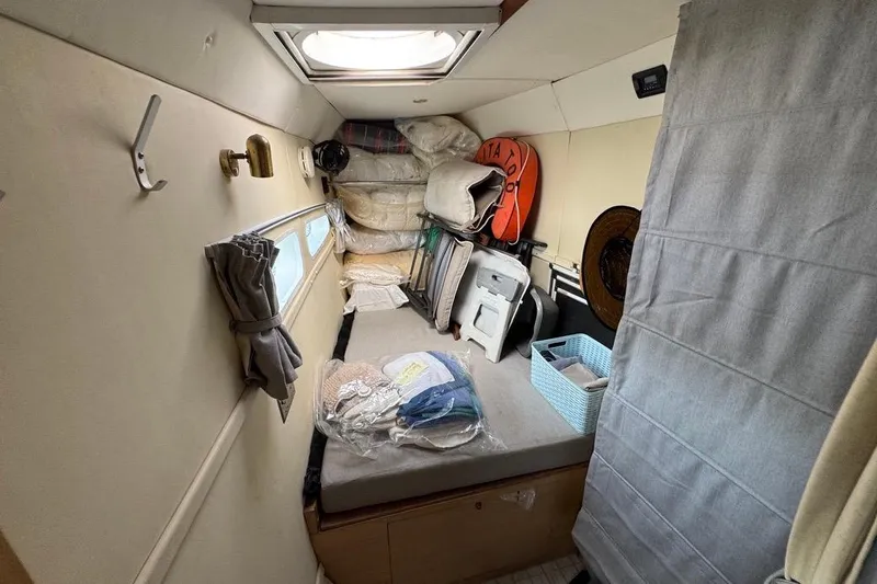 Alita Too Yacht Photos Pics Interior of a 2018 Custom COAST 50 boat with storage items and a skylight.