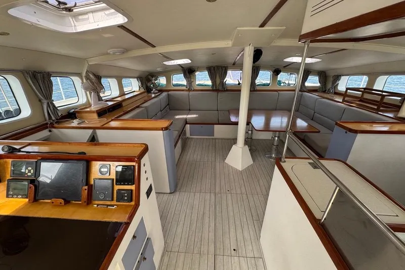 Alita Too Yacht Photos Pics Spacious interior of 2018 Custom COAST 50 yacht with elegant wood finishes and seating.