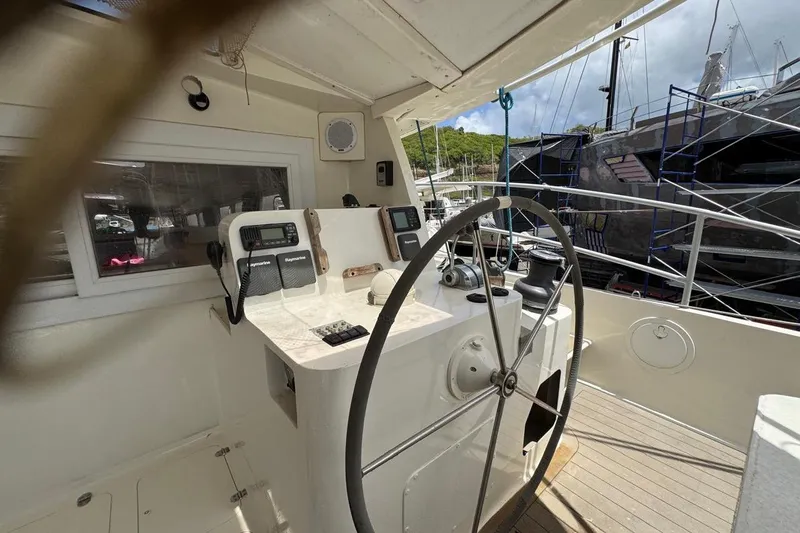 Alita Too Yacht Photos Pics Helm of 2018 Custom COAST 50 yacht with steering wheel and navigation equipment.
