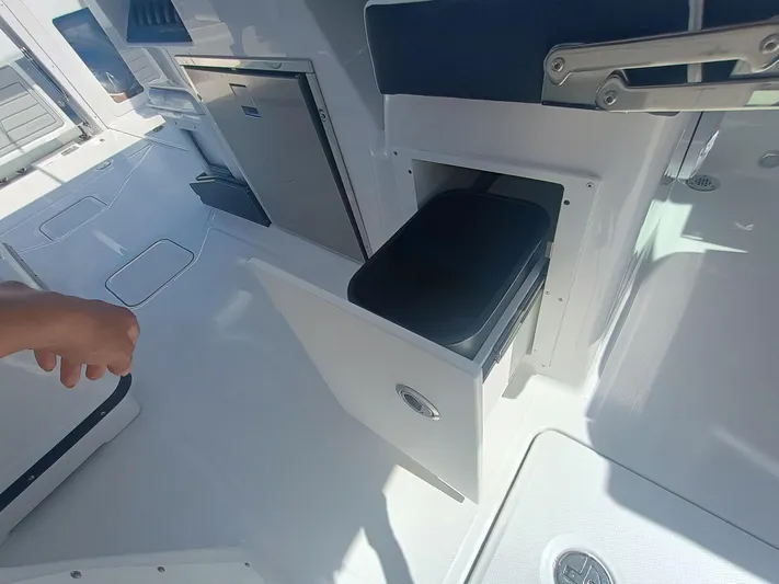 302-126 Yacht Photos Pics 2025 Blackfin 302 DC boat interior with storage compartment and modern amenities.