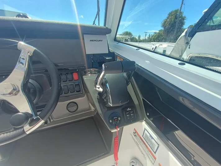 302-126 Yacht Photos Pics 2025 Blackfin 302 DC boat dashboard with steering wheel and control panel.