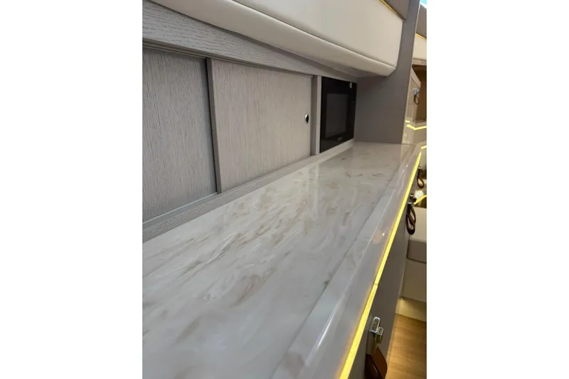  Yacht Photos Pics Luxurious interior of 2026 Level Yachts 43 STS with sleek countertops and modern design.