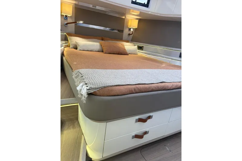  Yacht Photos Pics Luxurious bedroom interior of 2026 Level Yachts 43 STS, featuring elegant bedding and modern design.