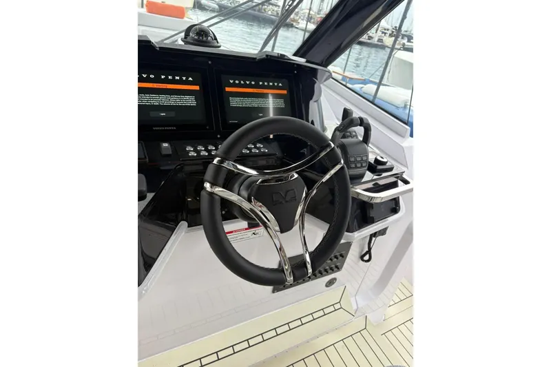  Yacht Photos Pics Steering wheel and controls of 2026 Level Yachts 43 STS, featuring dual Volvo Penta displays.