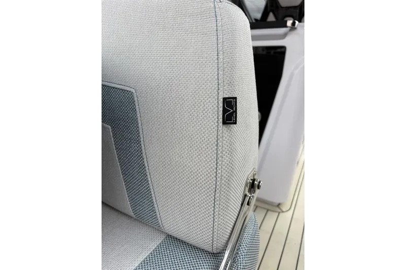  Yacht Photos Pics Close-up of 2026 Level Yachts 43 STS seat with logo tag and sleek design.