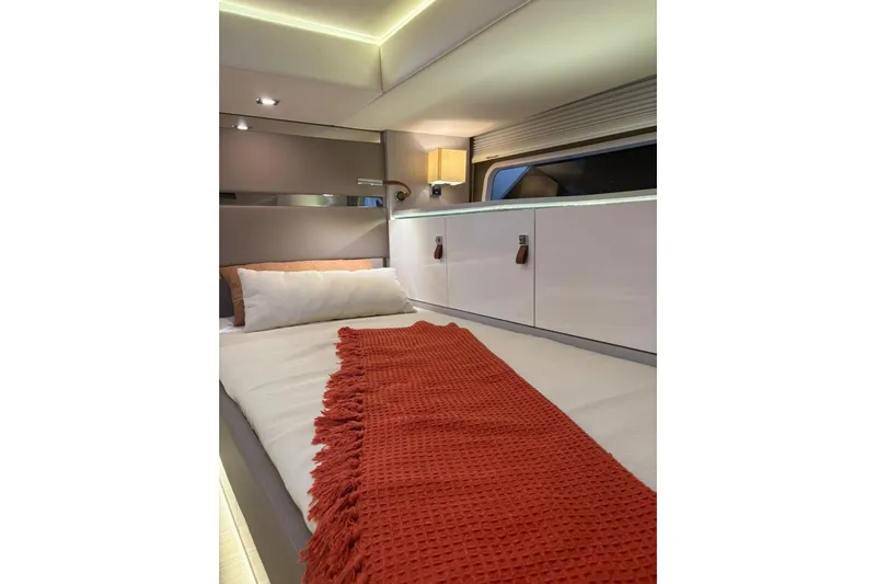  Yacht Photos Pics Luxurious cabin interior of 2026 Level Yachts 43 STS with cozy bedding and ambient lighting.