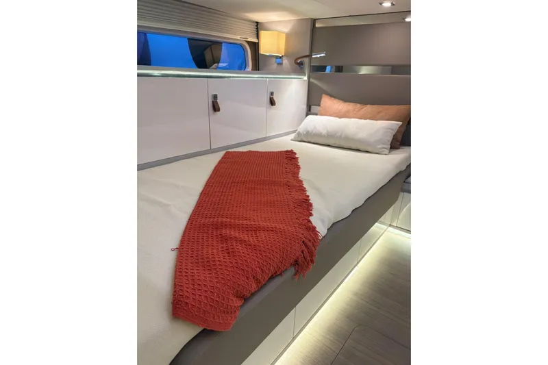 Yacht Photos Pics Luxurious cabin interior of 2026 Level Yachts 43 STS with cozy bedding and ambient lighting.