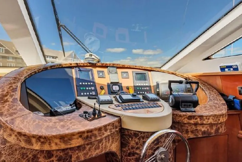 Elizee Yacht Photos Pics Helm of 1999 Azimut 85 Ultimate yacht with navigation instruments and leather finish.
