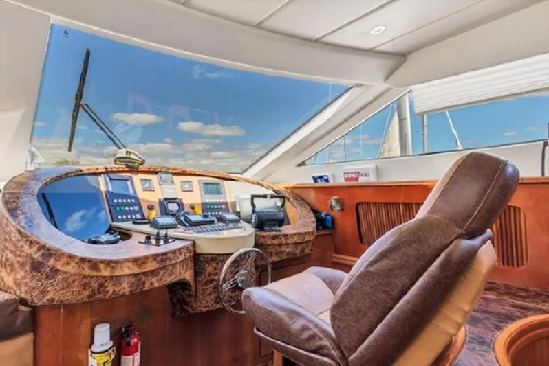 Elizee Yacht Photos Pics Luxurious helm of 1999 Azimut 85 Ultimate yacht with modern navigation equipment.