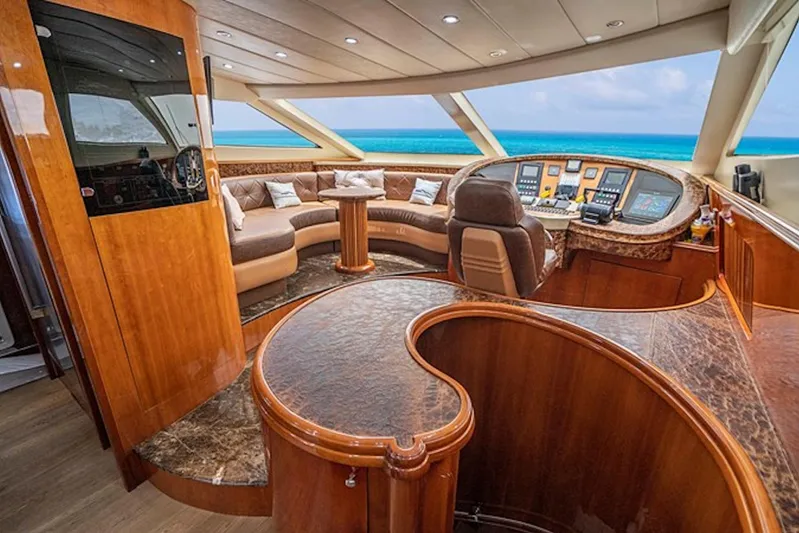 Elizee Yacht Photos Pics Luxurious interior of 1999 Azimut 85 Ultimate yacht with elegant wood finishes and ocean view.
