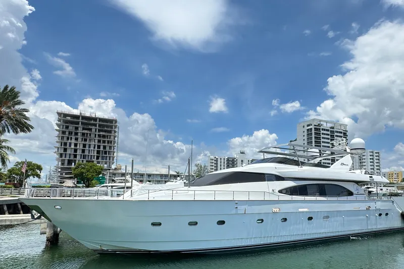 Elizee Yacht Photos Pics Luxury 1999 Azimut 85 Ultimate yacht docked in a marina under a clear blue sky.