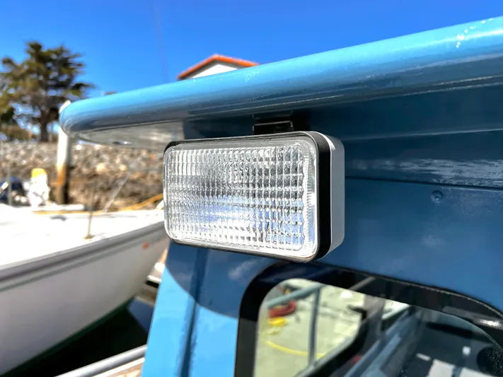 Acb Yacht Photos Pics Close-up of a mounted light on a blue ACB 30 boat, 2003 model.