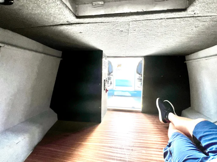 Acb Yacht Photos Pics Interior view of ACB 30 model, 2003, with person relaxing inside.