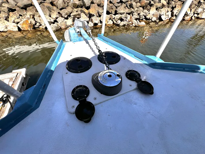 Acb Yacht Photos Pics Bow of ACB 30 boat with anchor chain and rocky shoreline, 2003 model.