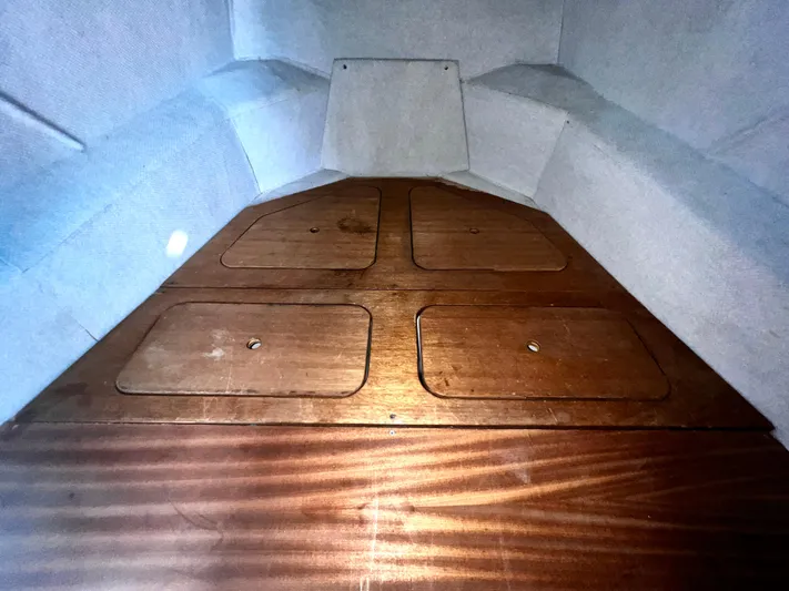 Acb Yacht Photos Pics Interior of ACB 30 boat, 2003 model, featuring wooden storage compartments.