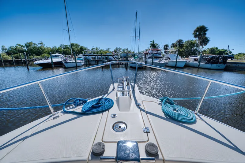 #r Dream Yacht Photos Pics Mainship 400 Trawler 2005 docked with blue ropes.