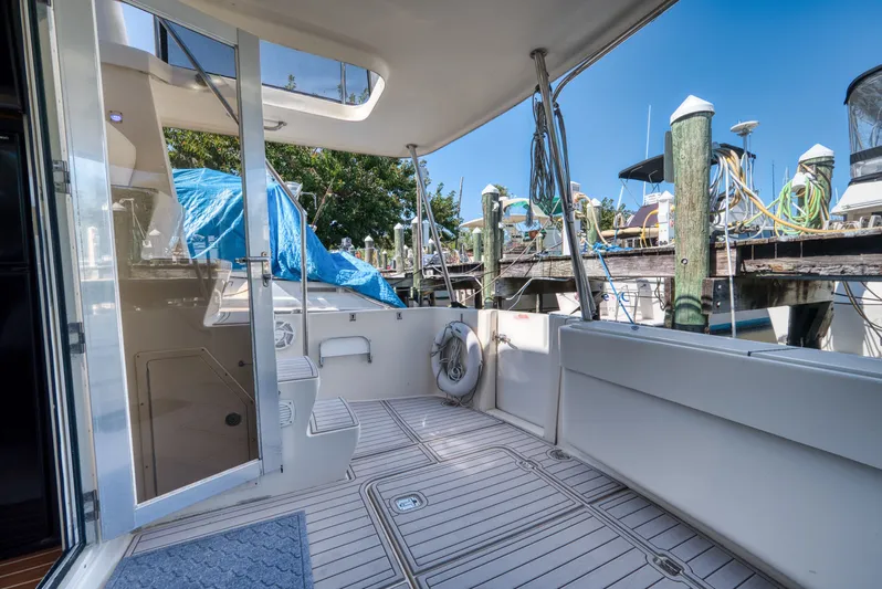 #r Dream Yacht Photos Pics Mainship 400 Trawler 2005, spacious deck, marina scene.