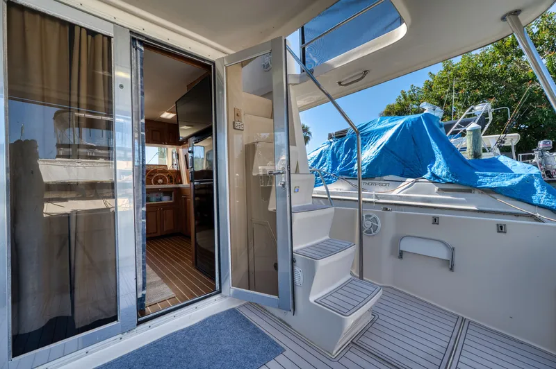 #r Dream Yacht Photos Pics Mainship 400 Trawler 2005, interior view with stairs and kitchen.