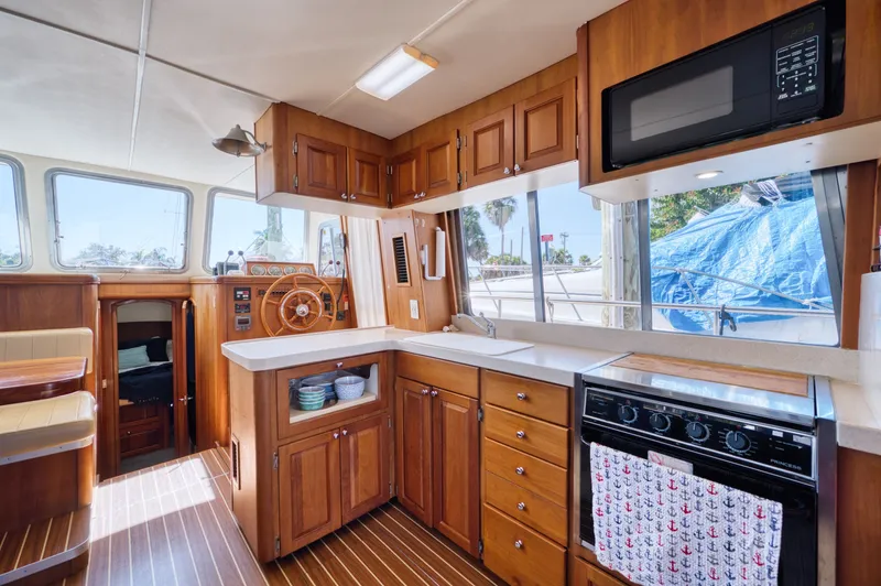 #r Dream Yacht Photos Pics Interior of 2005 Mainship 400 Trawler with wooden kitchen.