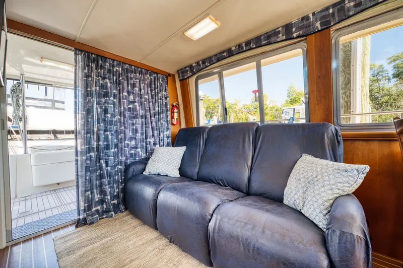 #r Dream Yacht Photos Pics Interior of a 2005 Mainship 400 Trawler with blue couch.