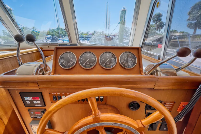 #r Dream Yacht Photos Pics Helm of a 2005 Mainship 400 Trawler with wooden finish.