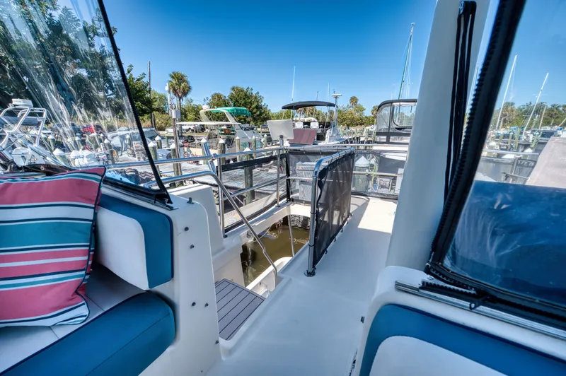 #r Dream Yacht Photos Pics 2005 Mainship 400 Trawler in sunny marina setting.