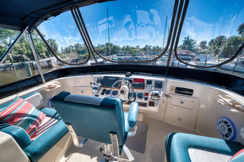 #r Dream Yacht Photos Pics Interior view of 2005 Mainship 400 Trawler helm with blue seats.