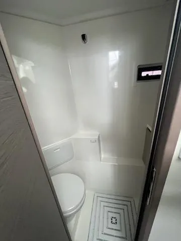 Emily Yacht Photos Pics 2022 Fountaine Pajot MY4.S yacht bathroom with modern white interior design.