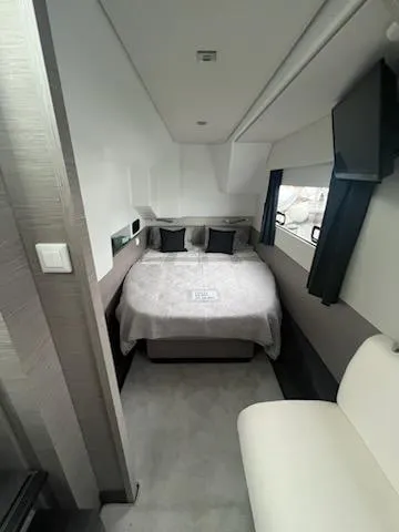 Emily Yacht Photos Pics 2022 Fountaine Pajot MY4.S cabin interior with bed, modern design, and window view.
