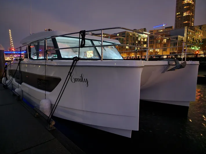 Emily Yacht Photos Pics 2022 Fountaine Pajot MY4.S yacht docked at night in a city marina.