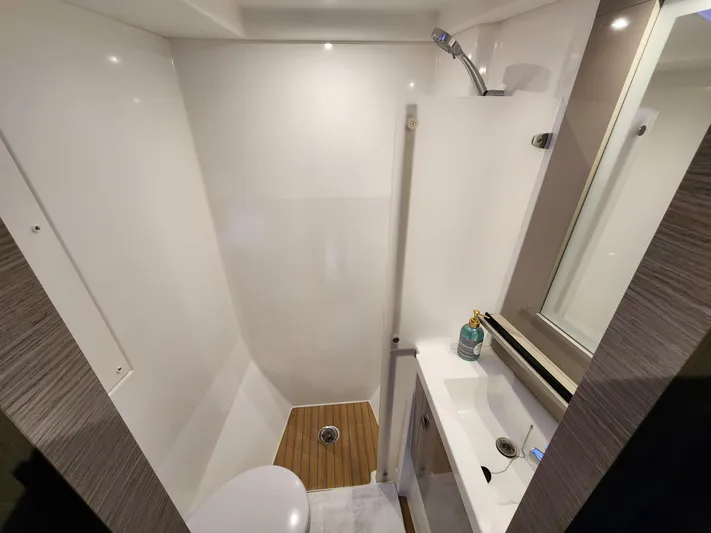 Emily Yacht Photos Pics Compact bathroom in 2022 Fountaine Pajot MY4.S yacht with shower and sink.