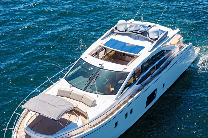 Blue Daksa Yacht Photos Pics Luxurious 2013 Absolute 64 yacht cruising on clear blue waters.