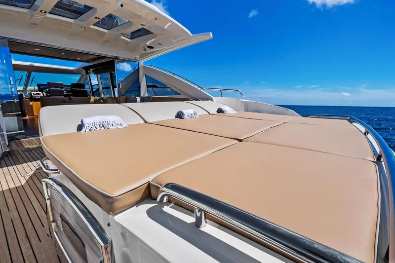 Blue Daksa Yacht Photos Pics Luxurious 2013 Absolute 64 yacht with sunbathing deck, ocean view, and clear blue sky.