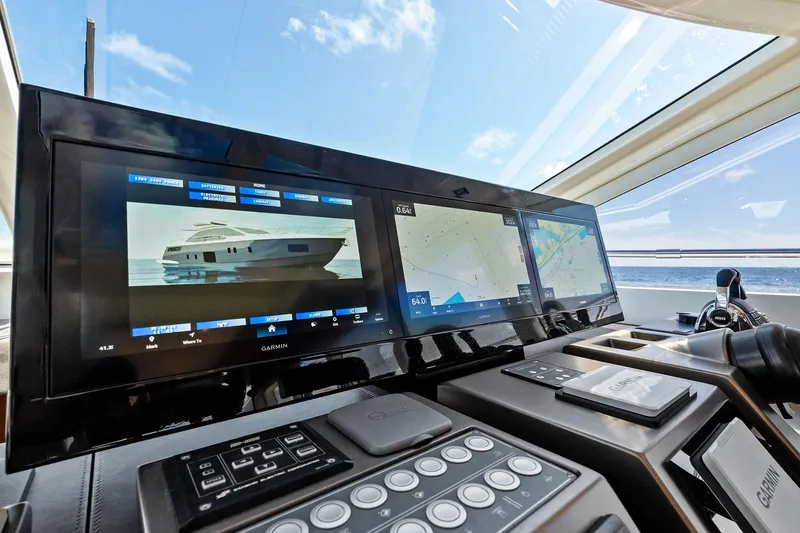 Blue Daksa Yacht Photos Pics Control panel of 2013 Absolute 64 yacht with navigation screens and ocean view.