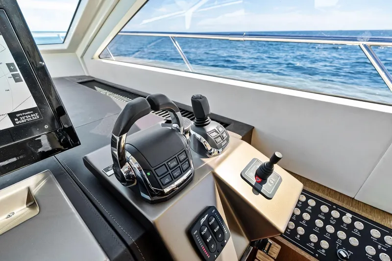 Blue Daksa Yacht Photos Pics Control panel of a 2013 Absolute 64 yacht with ocean view.