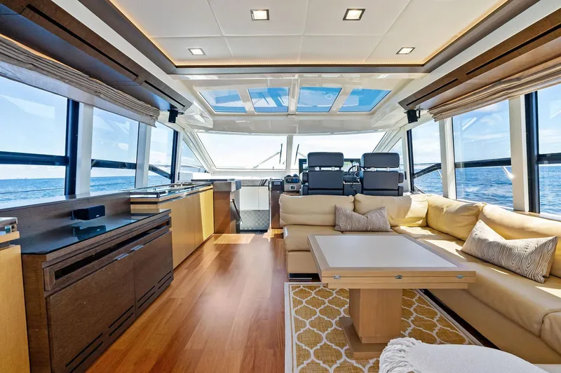 Blue Daksa Yacht Photos Pics Luxurious interior of 2013 Absolute 64 yacht with modern furnishings and ocean view.
