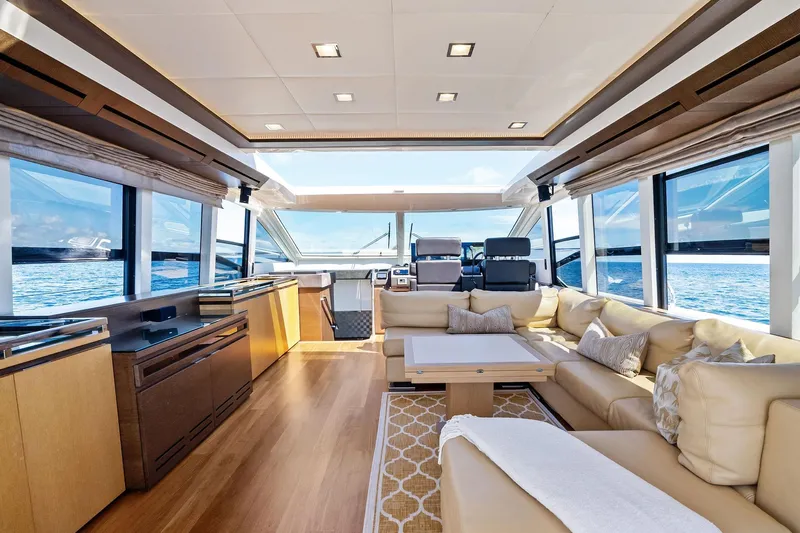 Blue Daksa Yacht Photos Pics Luxurious interior of 2013 Absolute 64 yacht with elegant seating and ocean view.