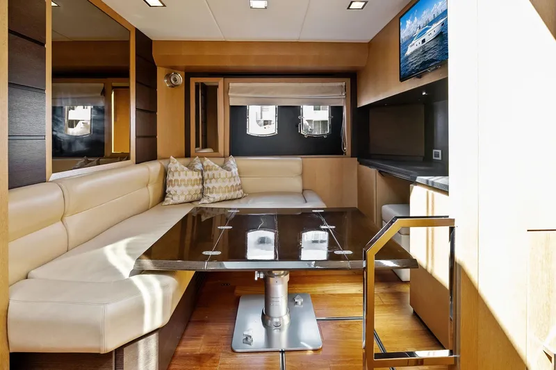 Blue Daksa Yacht Photos Pics Luxurious interior of 2013 Absolute 64 yacht with elegant seating and modern decor.