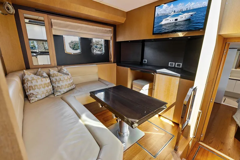Blue Daksa Yacht Photos Pics Luxurious interior of a 2013 Absolute 64 yacht with elegant seating and modern amenities.