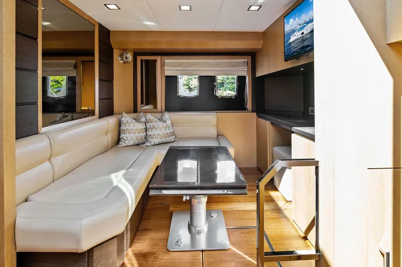 Blue Daksa Yacht Photos Pics Luxurious interior of 2013 Absolute 64 yacht with elegant seating and modern decor.